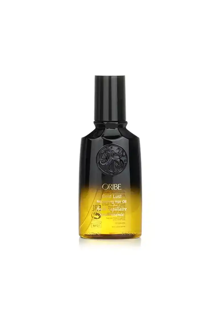 Luxury Oribe Gold Lust hair oil bottle, black and gold design.